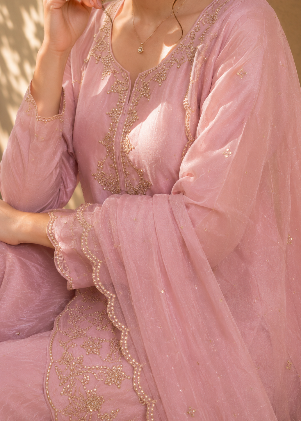 Pink traditional outfit with gold embroidery