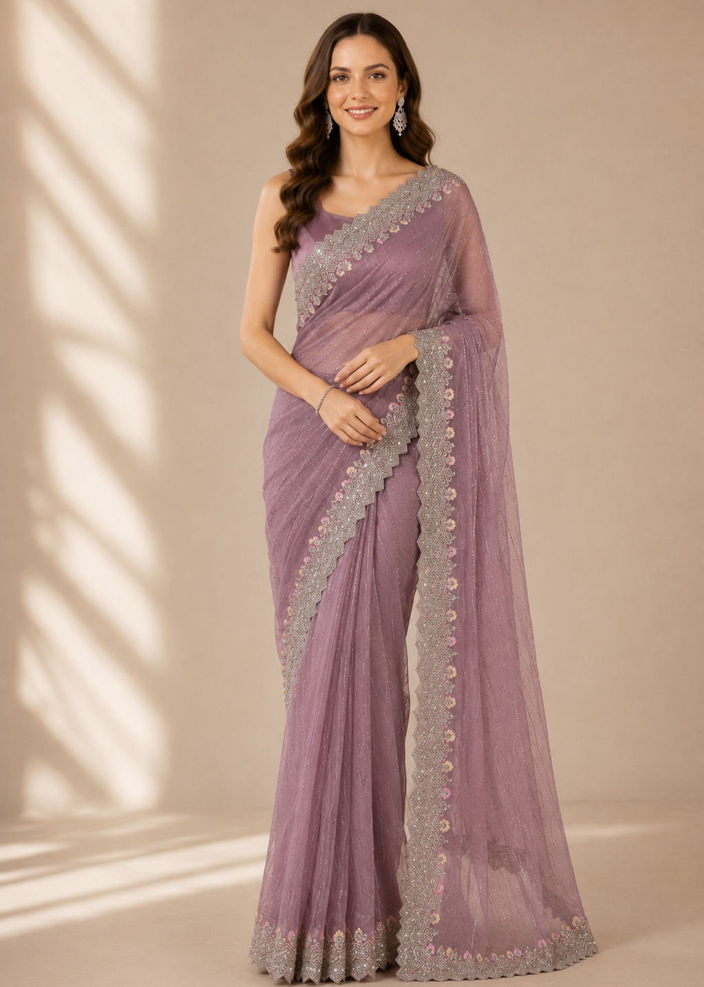 Woman wearing a purple saree with silver border against a beige background