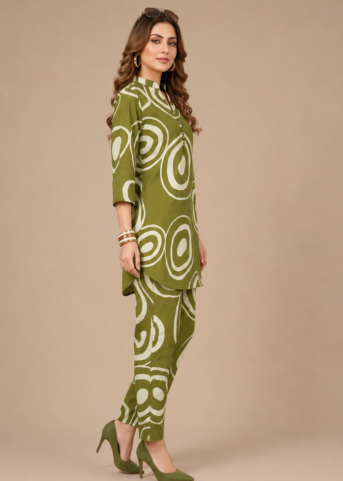 Woman wearing a green patterned outfit on a beige background