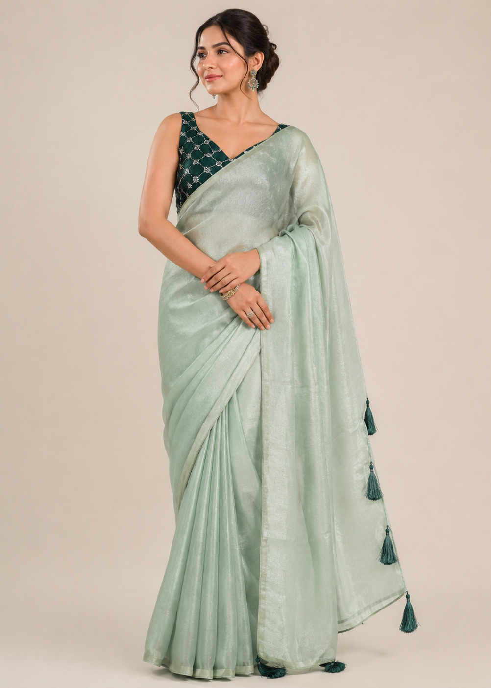 Mint Green Tissue Silk Saree with Tassel Pallu & Emerald Embroidered Sequin Blouse
