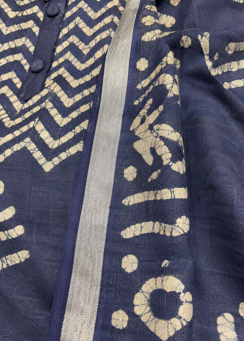 Navy blue fabric with beige geometric patterns