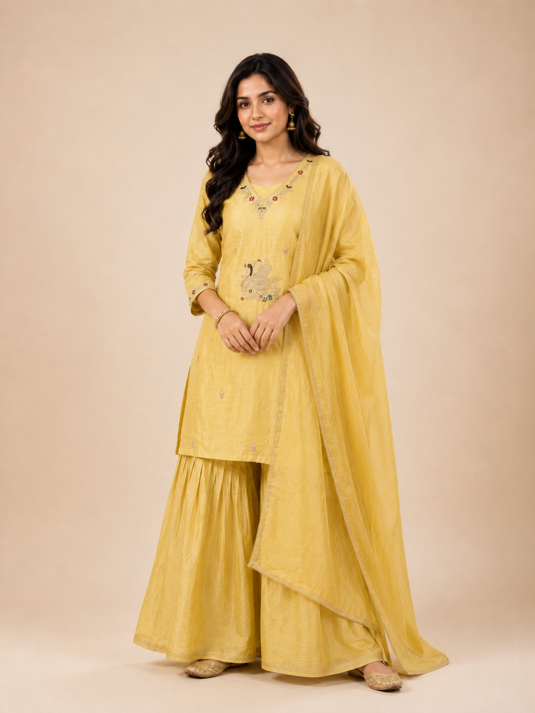 Woman wearing a yellow traditional outfit with a beige background