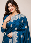Teal Blue Satin Georgette Saree with Allover Embroidered Weaving Jari Butta & Floral Border