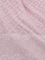 Pink fabric with white paisley pattern